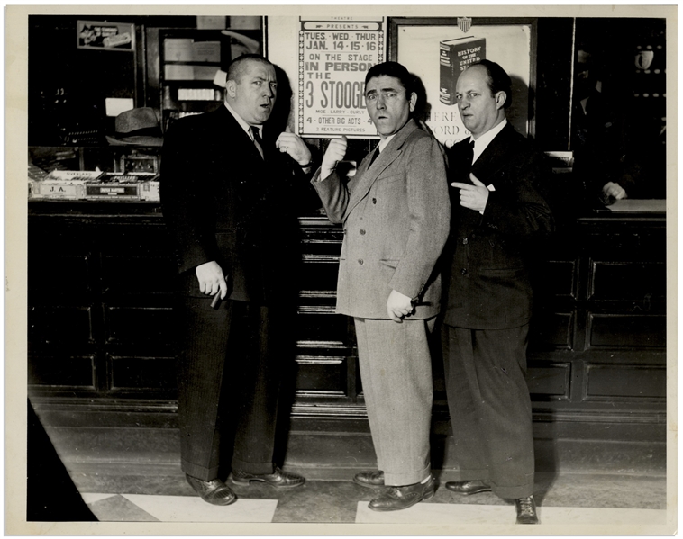 10 x 8 Glossy Publicity Photo From 1939, With Curly, Moe & Larry Standing in Front of a 3 Stooges Poster -- Label on Verso Reads on tour in Fallriver, Mass. -- Very Good Plus Condition
